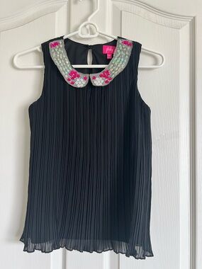 Pinky Hot Pink Logo Tag on Black Garment